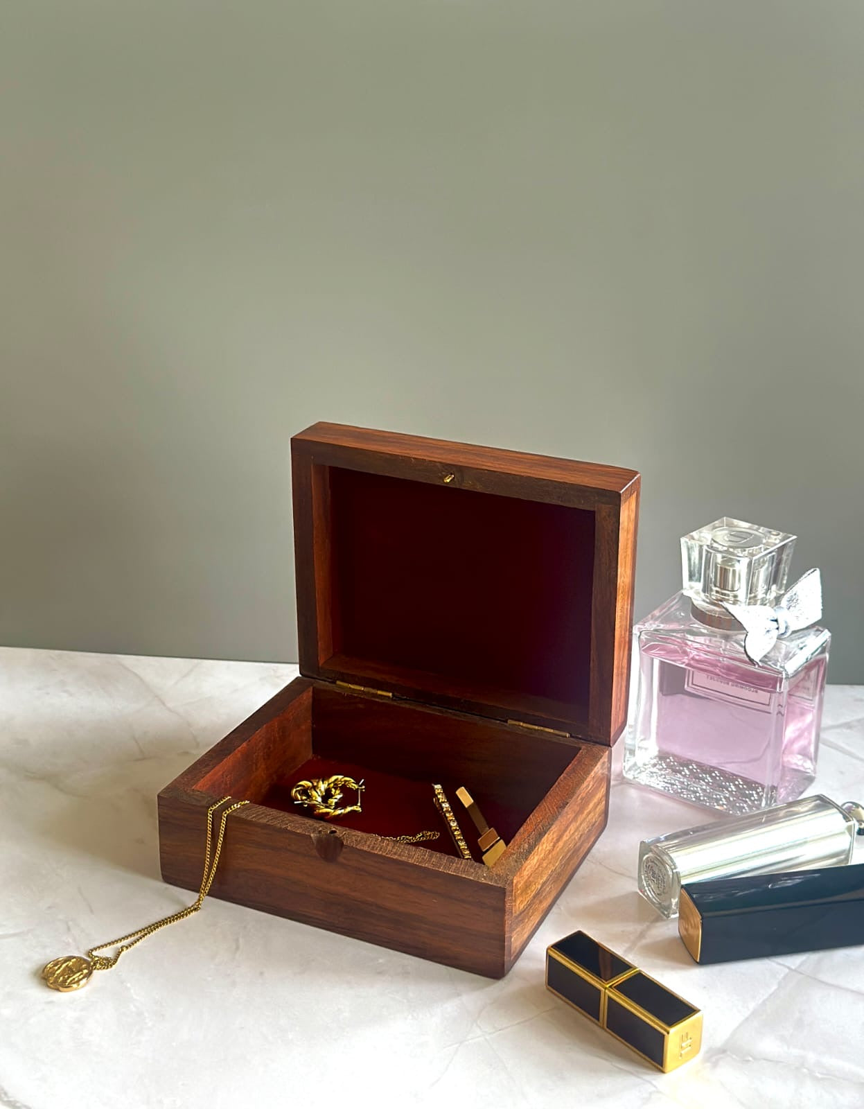 rectangular wooden box with red velvet lining to keep jewelry and trinkets