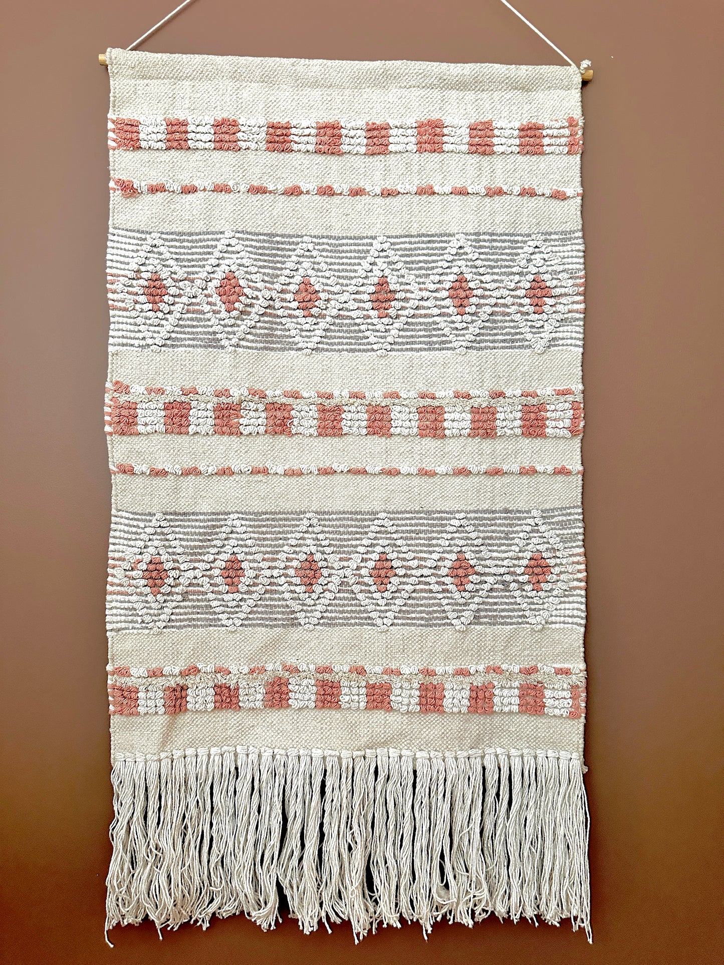 handmade cotton and wool wall tapestry in ivory and peach